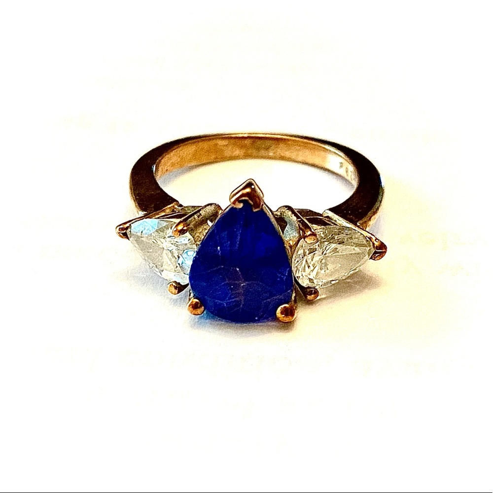 14K yellow gold ring with center set tanzanite accented with diamonds